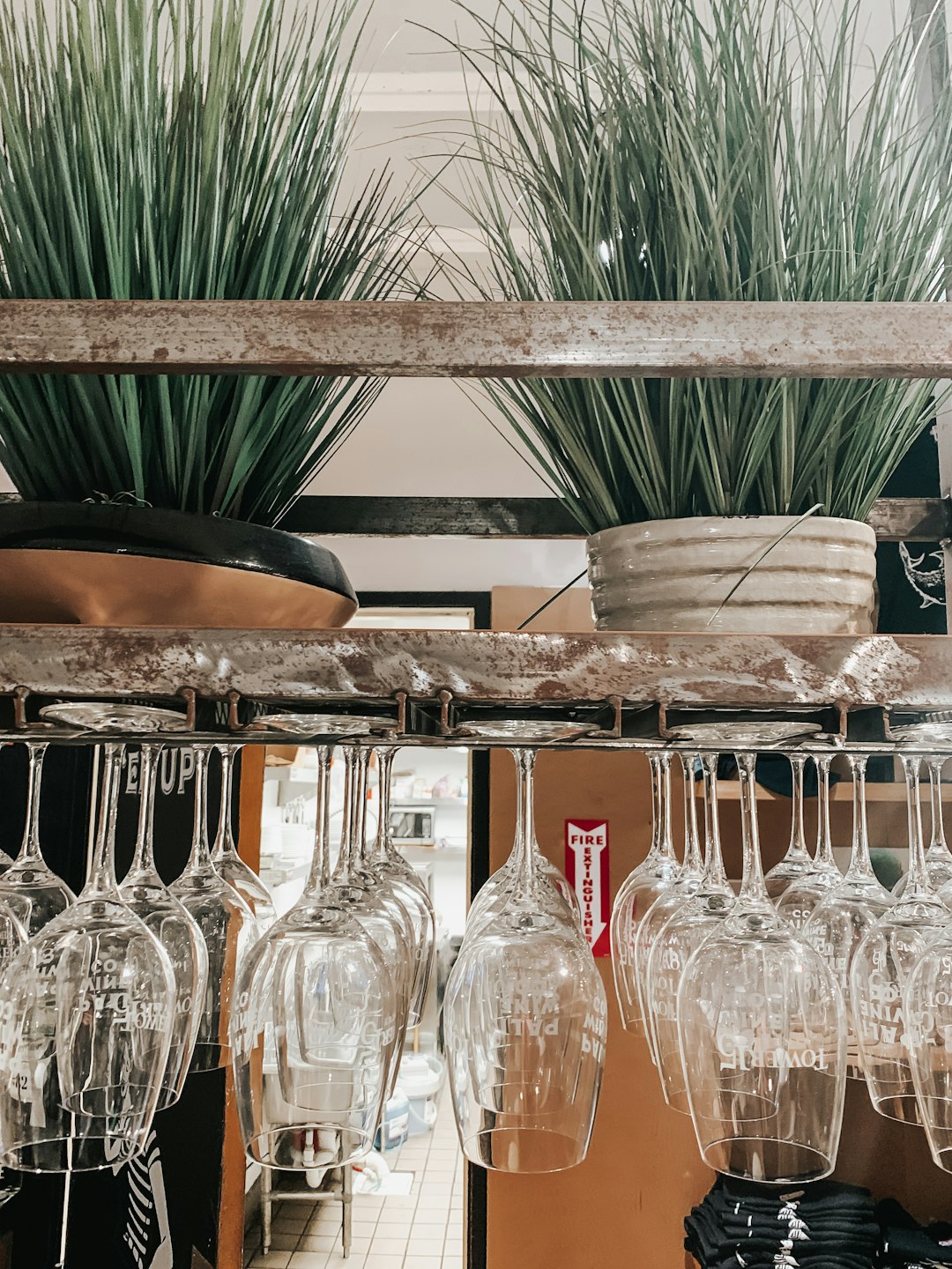 clear glass jars on brown wooden shelf