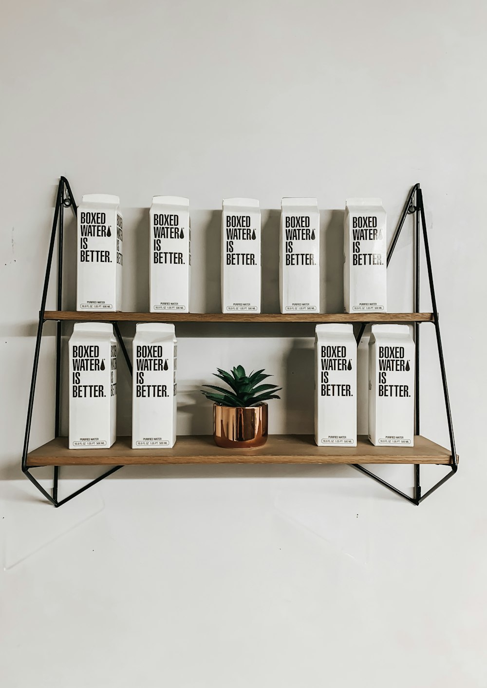 white and black labeled boxes on brown wooden rack