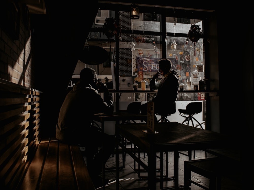 people sitting on chair in restaurant