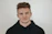 man in black hoodie standing