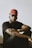 man in black crew neck t-shirt wearing red cap