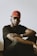 man in black crew neck t-shirt wearing red cap