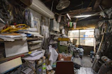 A candid photo of a busy workspace cluttered with tools and projects in progress.