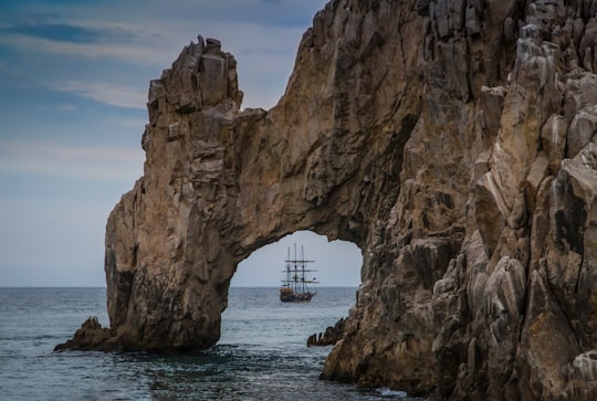 brown rock formation on sea during daytime in El Arco de Cabo San Lucas Mexico