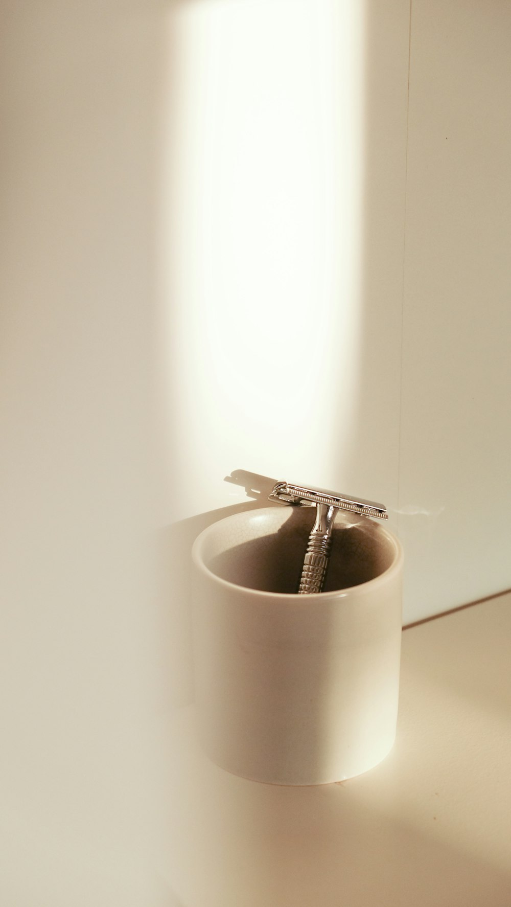 silver keys on white ceramic mug