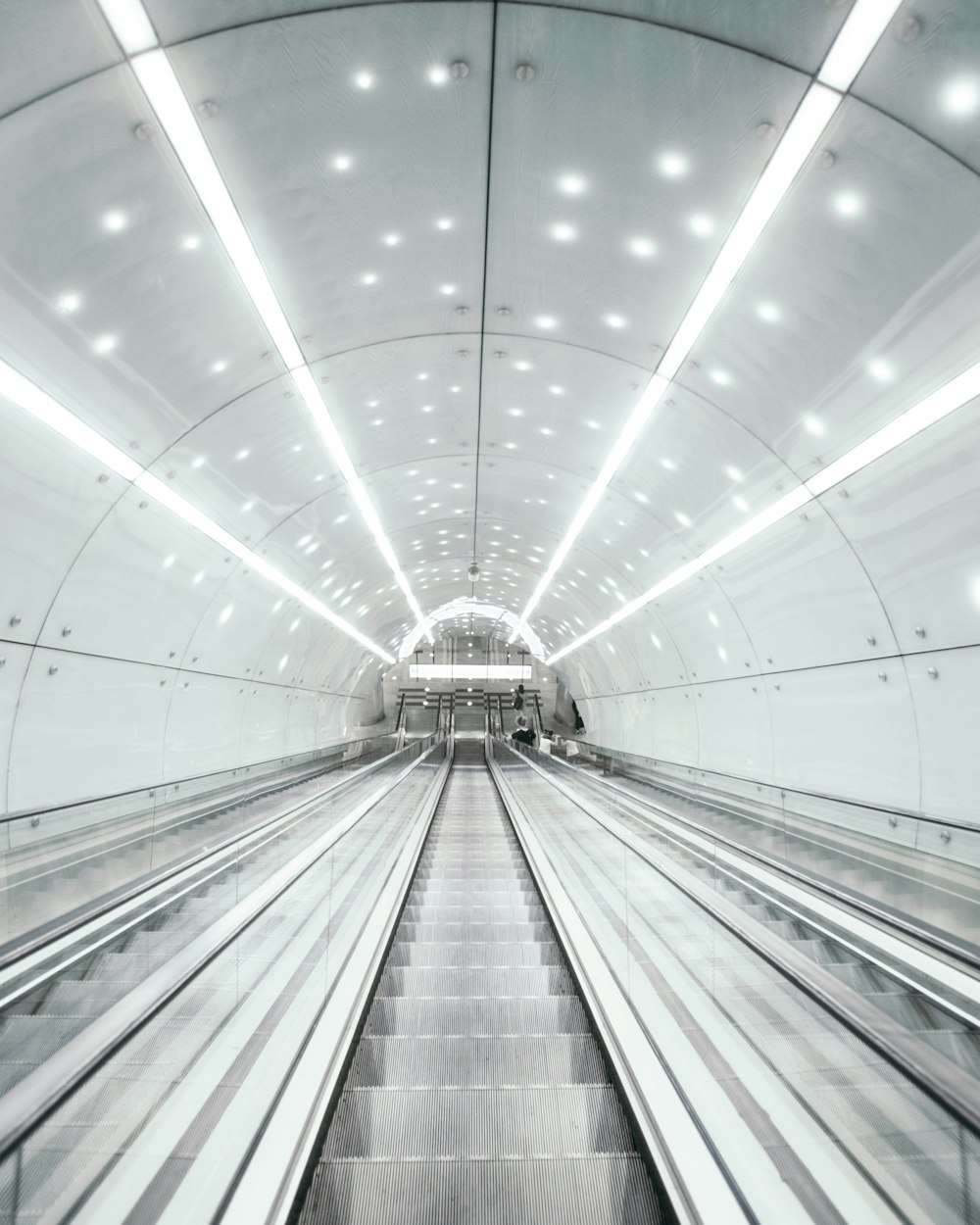 people walking on tunnel during daytime