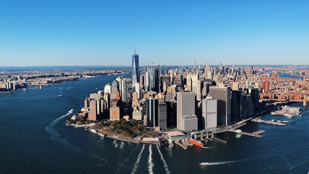 city skyline across body of water during daytime