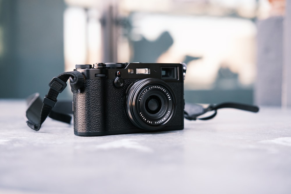 black nikon dslr camera on table