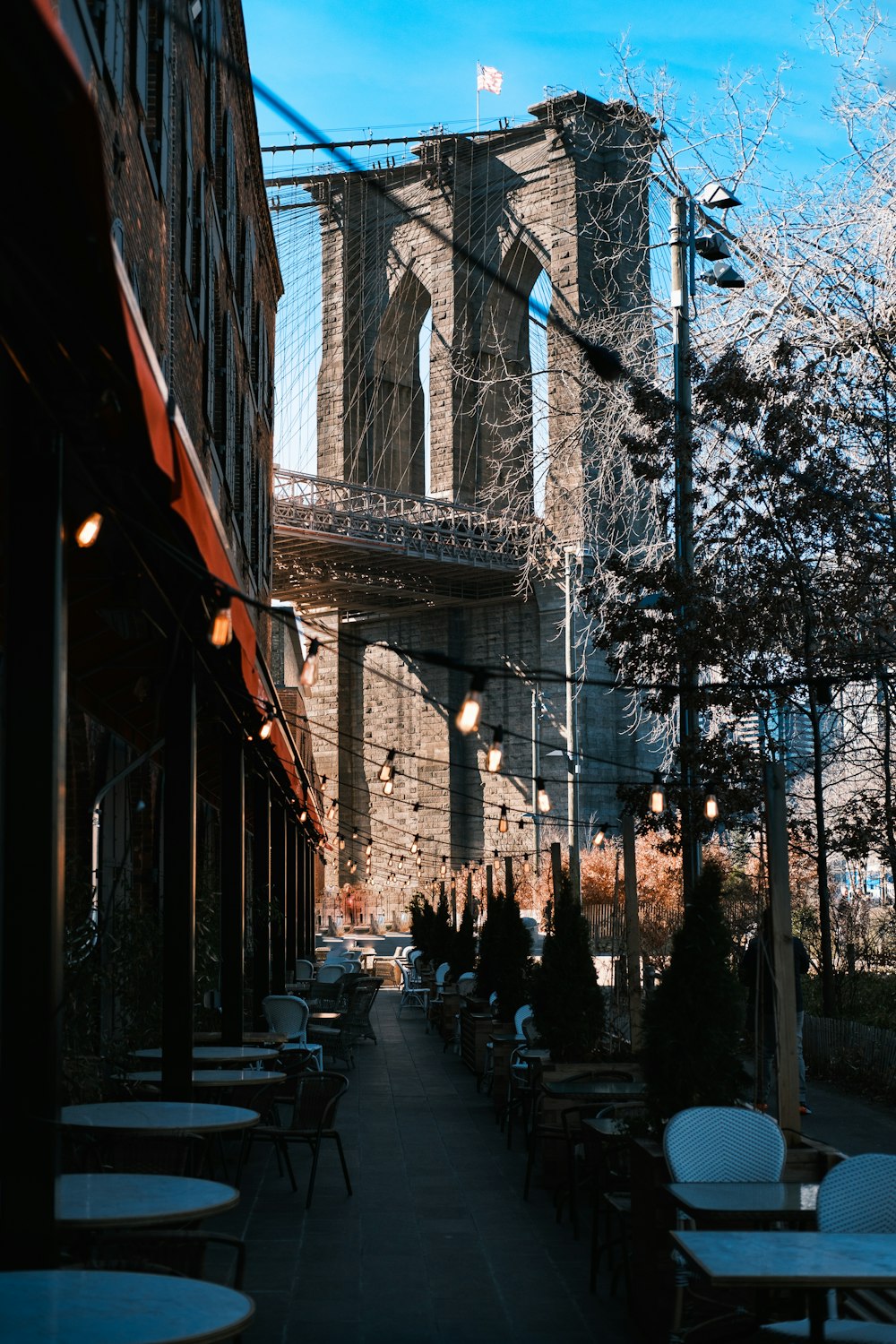 people walking on sidewalk near building during daytime