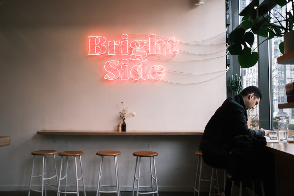 brown wooden table with white chairs