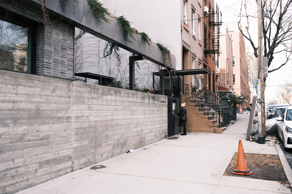 black metal fence on gray concrete wall during daytime