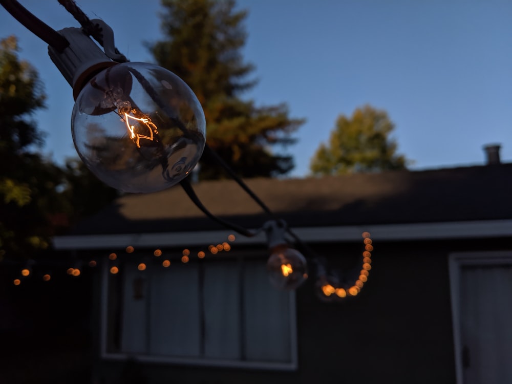 clear glass ball on black metal wire