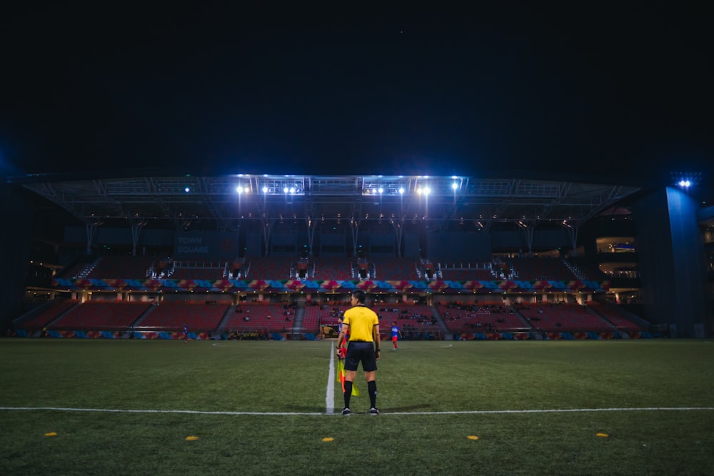 people playing soccer during nighttime