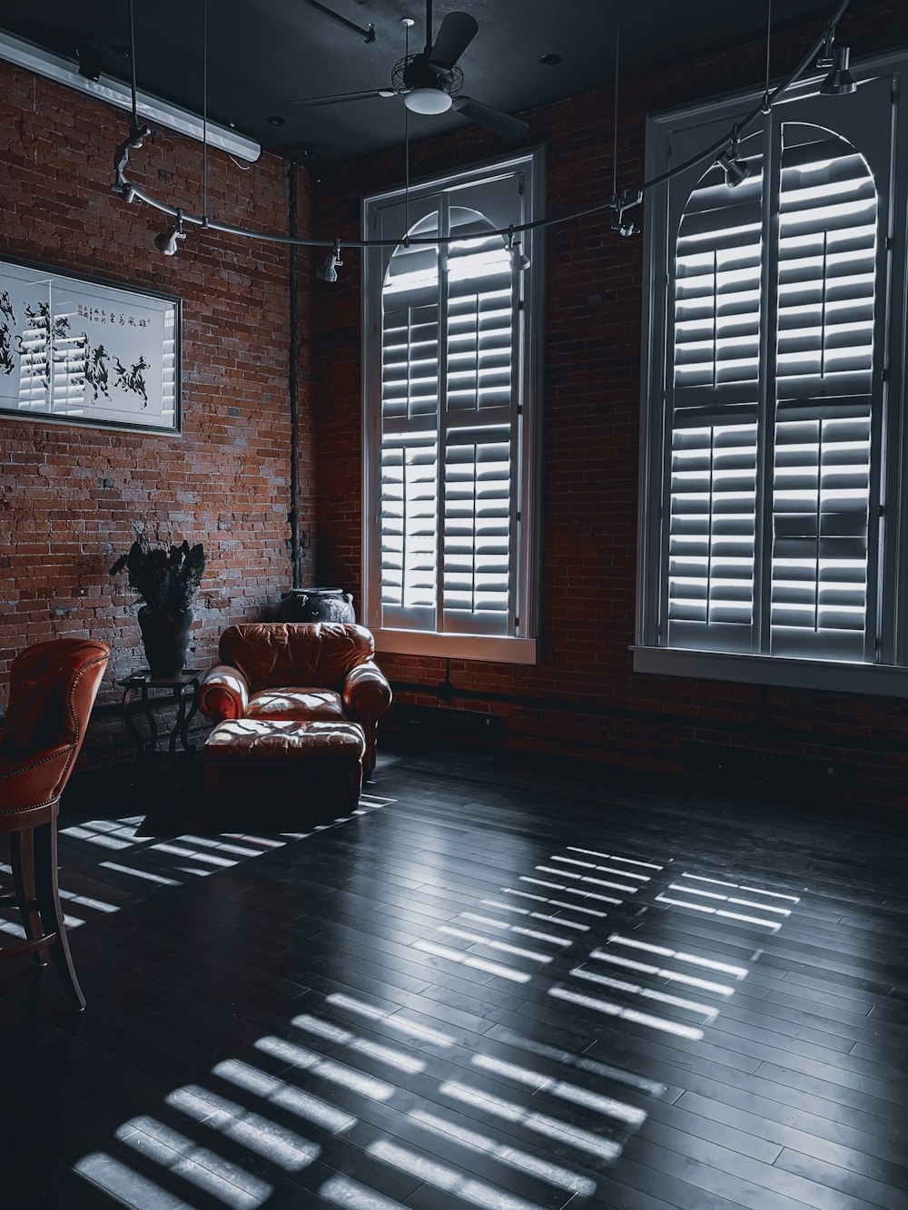 red leather armchair beside window