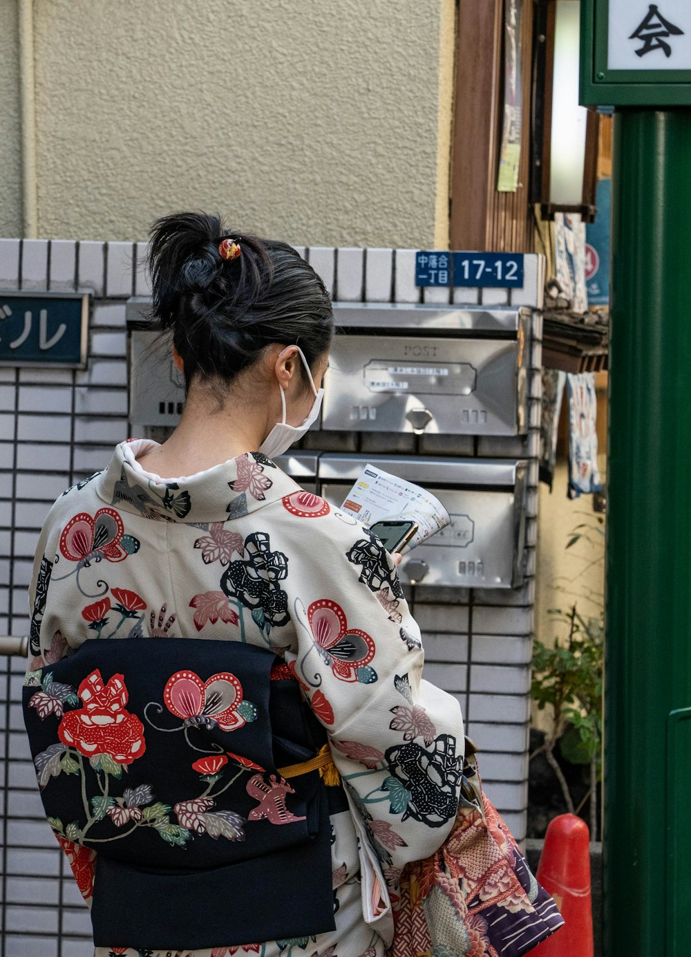 woman in white red and black floral kimono