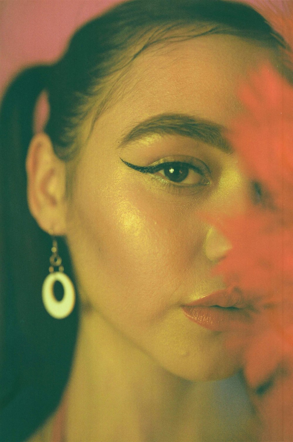 woman wearing silver drop earrings