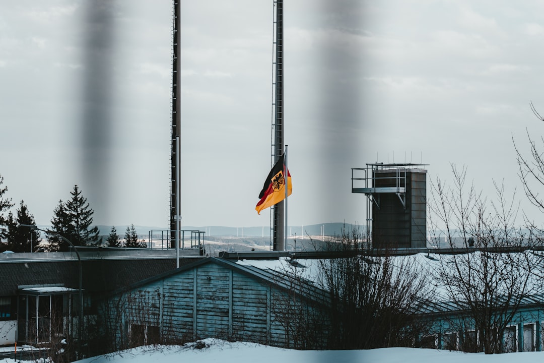 black and yellow flag on top of building