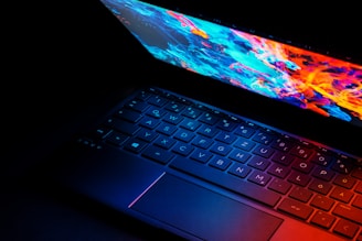black laptop computer turned on displaying desktop