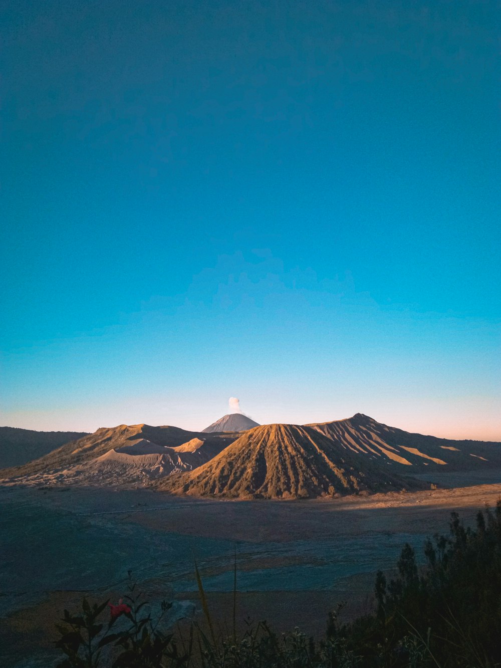 brown mountain under blue sky during daytime