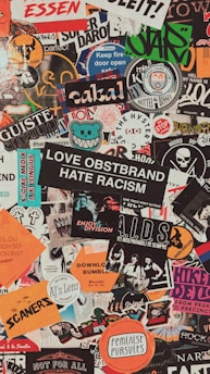 assorted stickers on white wall