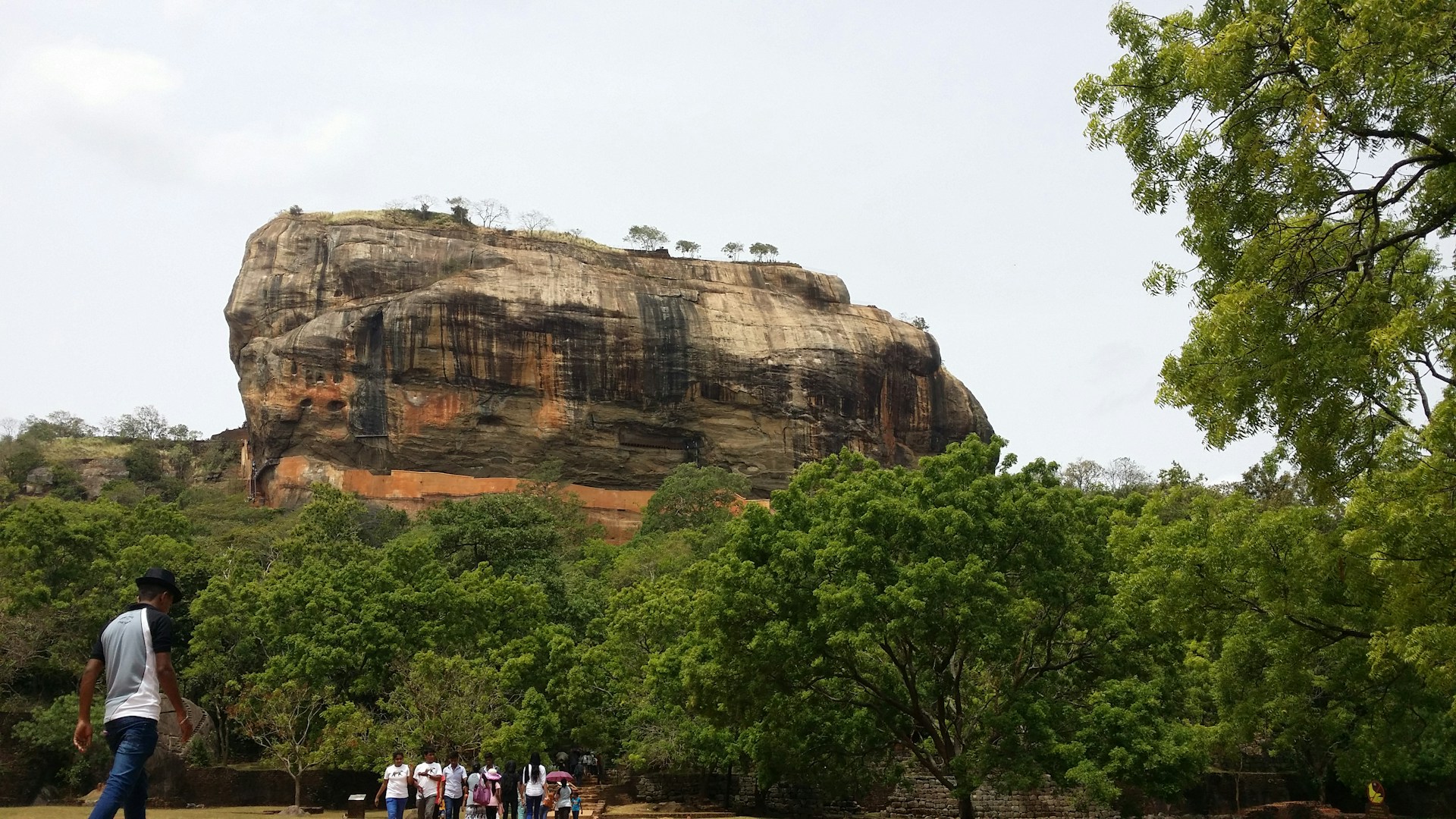 woman wearing yellow long-sleeved dress under white clouds and blue sky during daytime