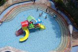 Outdoor pool area with shallow section for children.