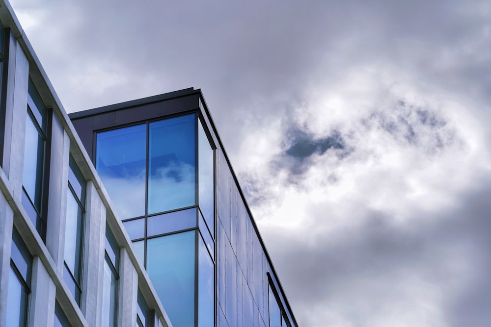 grayscale photo of glass window building