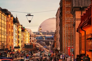 The narrow streets of Victoria's town center with colorful houses and everyday life scenes.