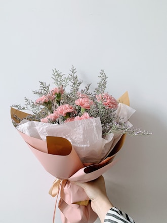 bouquet of flowers on brown wooden table