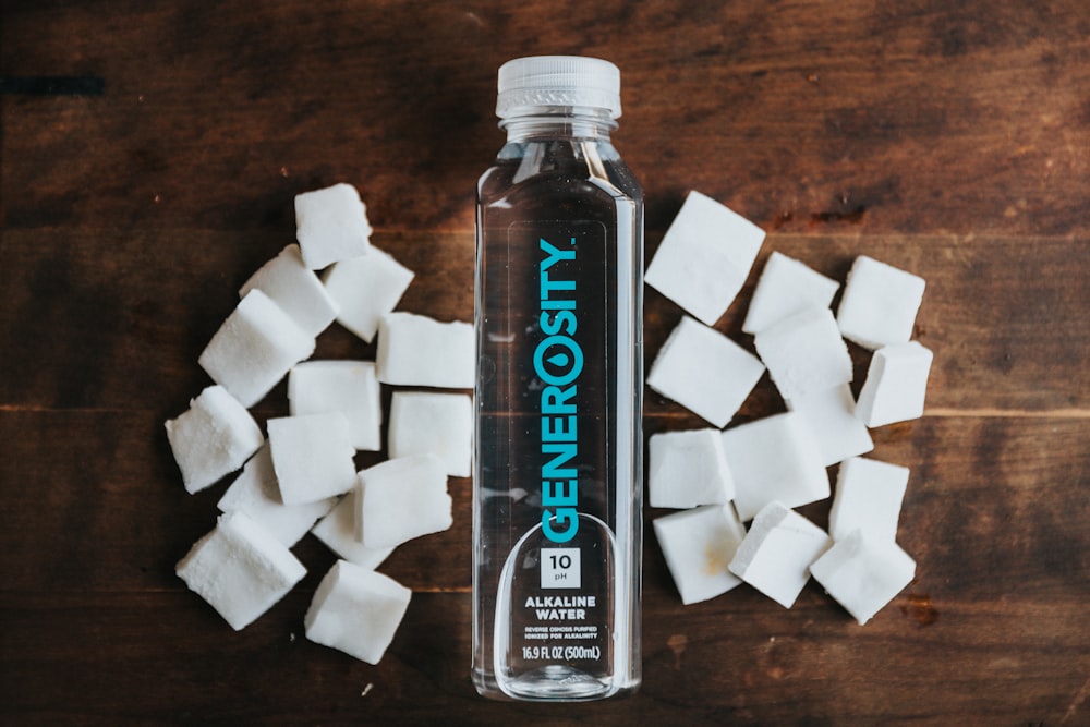 white and black sugar cubes on brown wooden table