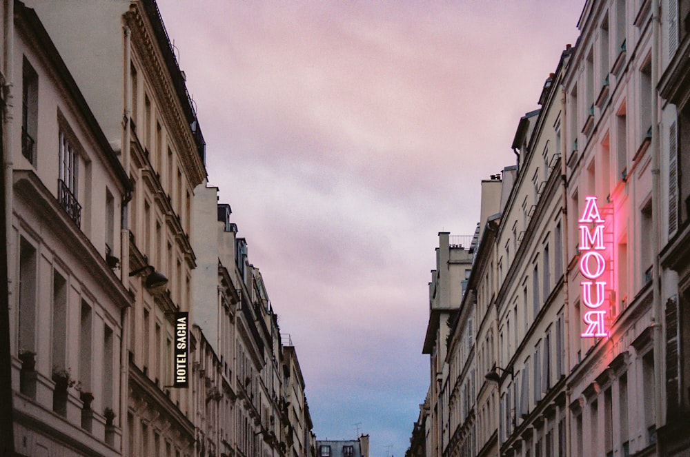 people walking on street between high rise buildings during daytime