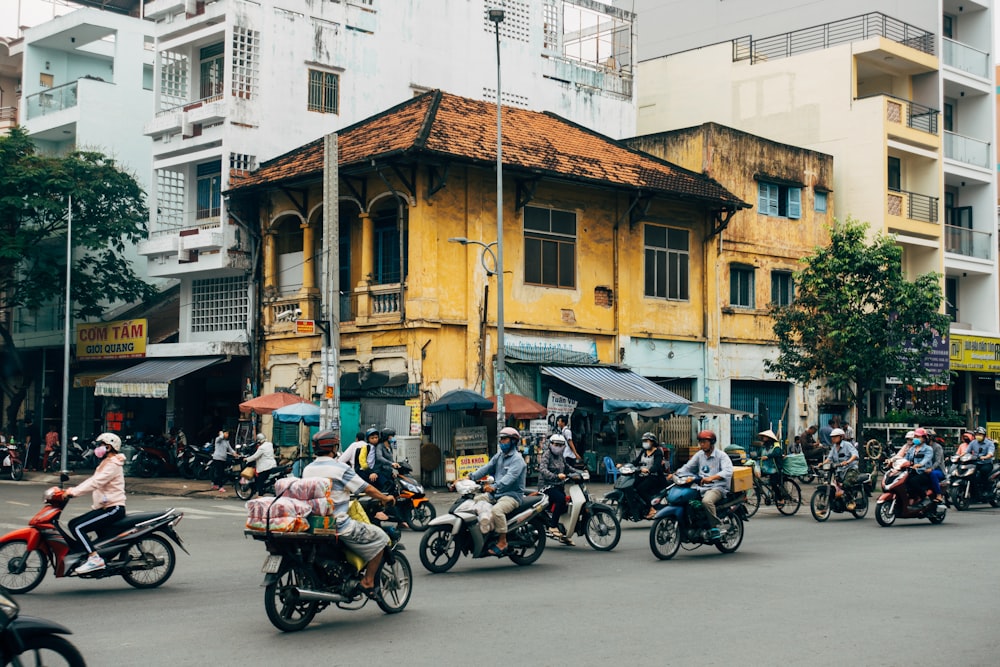 motorcycle parked beside brown concrete building during daytime