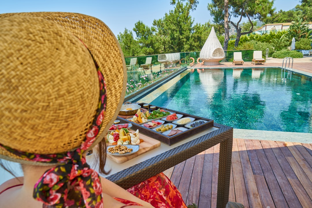 brown wicker hat on brown wooden table, healthy breakfast in a luxury hotel