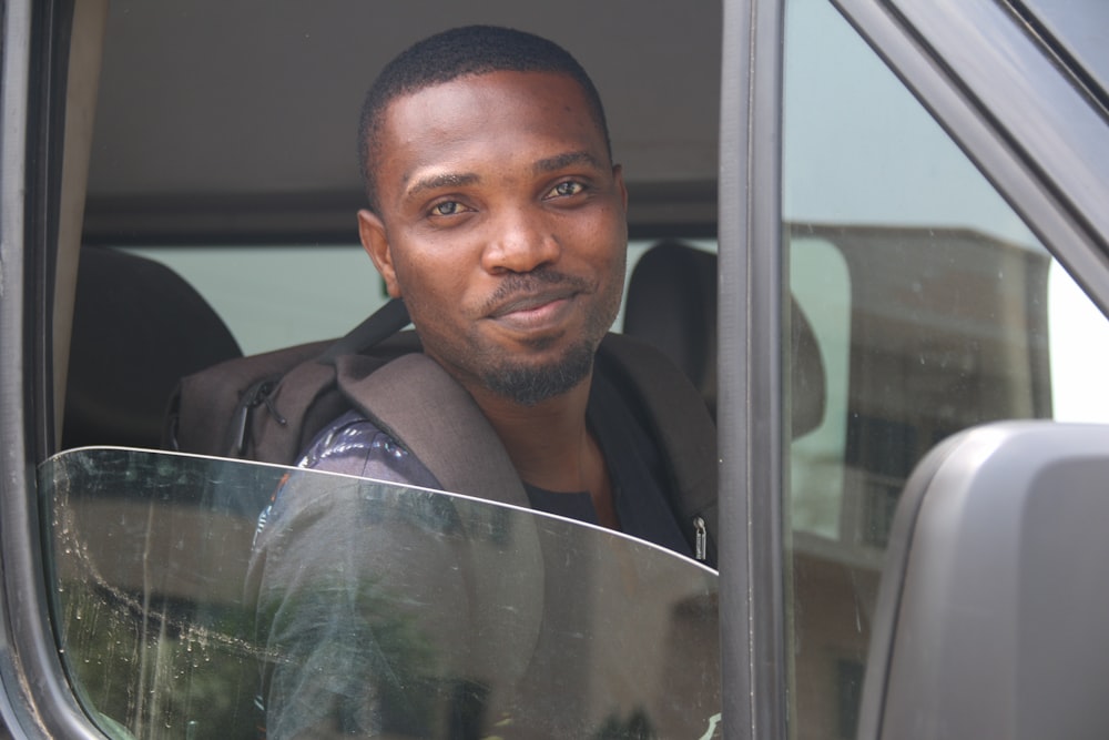 man in black shirt smiling