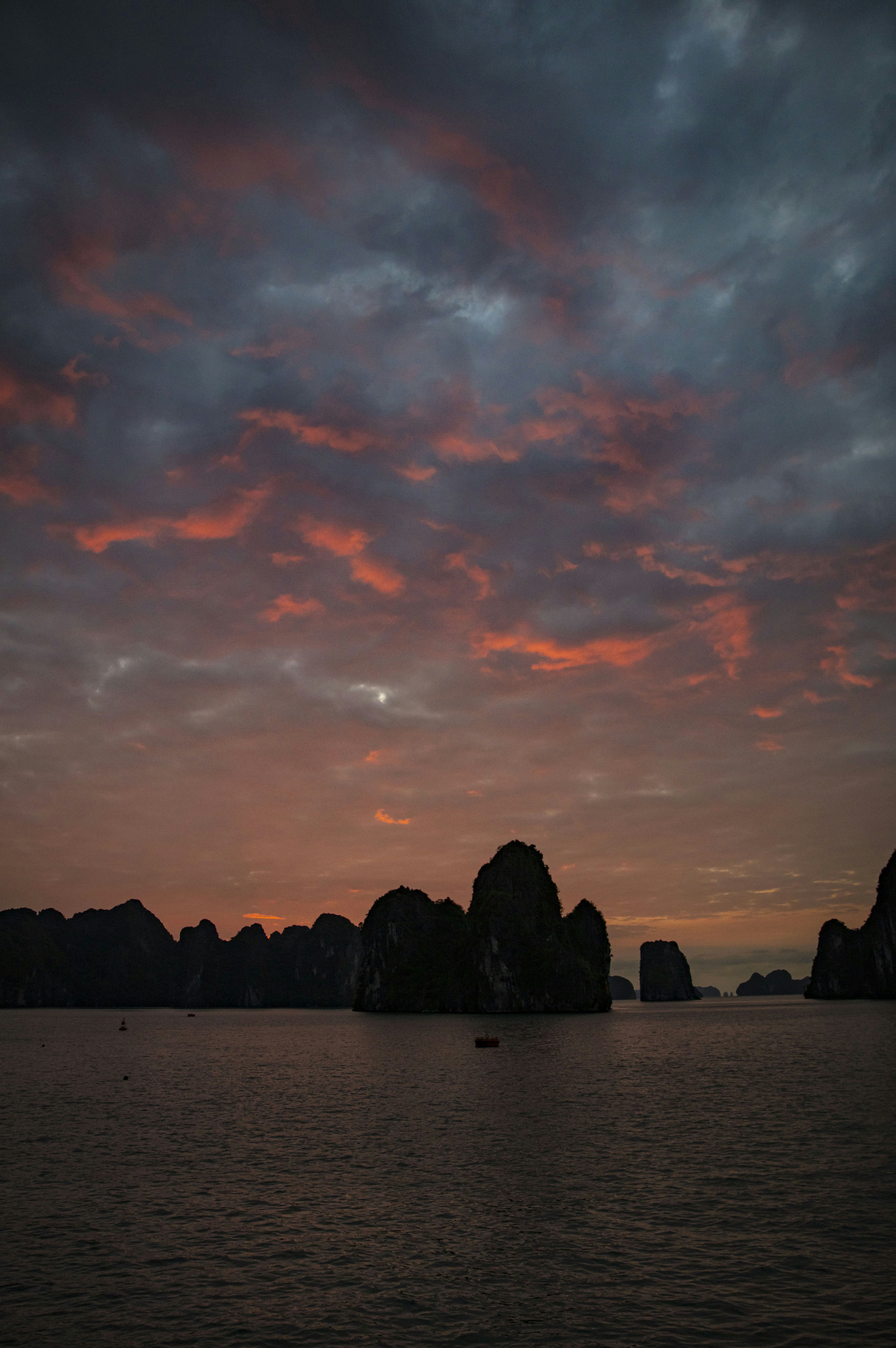 Thailand Phi Phi islands at dusk with dark sea and shadowy limestone cliffs
