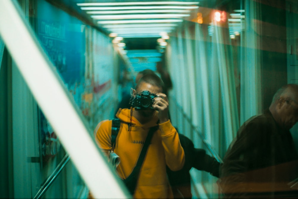 woman in yellow jacket wearing black sunglasses