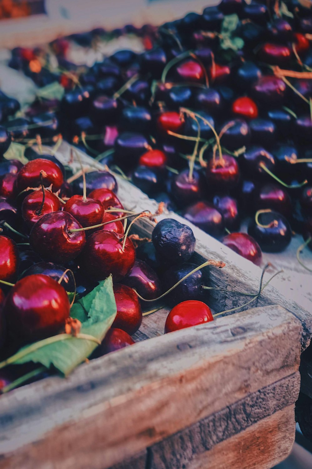 red cherries on brown wooden table