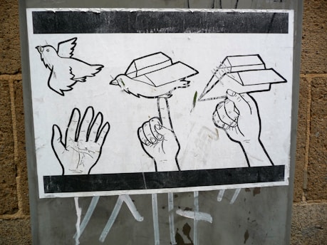 A black and white illustration depicting a sequence of a hand transforming into a paper airplane. The progression shows an open hand, a hand with a paper bird perched on the index finger, and finally, a hand holding a paper airplane ready to fly. The artwork is displayed on a textured surface.