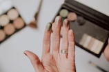 person wearing silver diamond ring