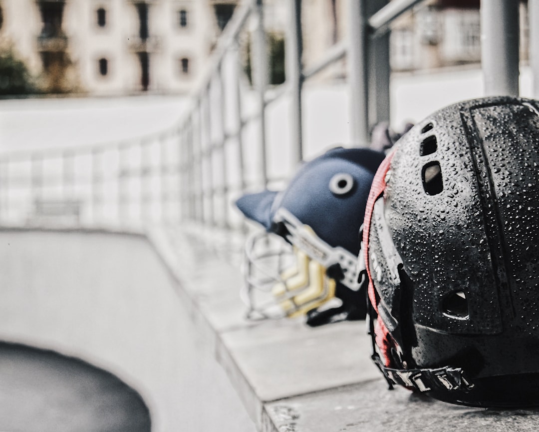 black and red helmet on gray concrete floor