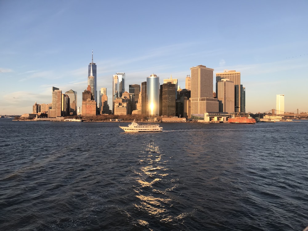 city skyline across body of water during daytime