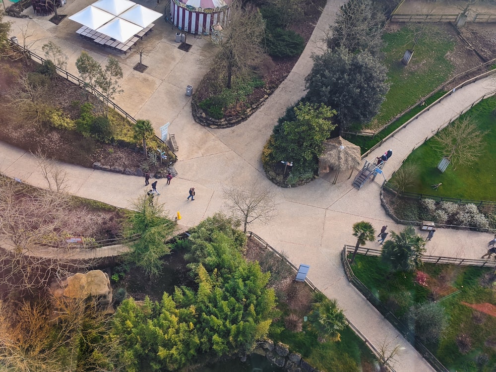 people walking on white concrete pavement during daytime