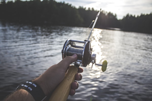 Person holding fishing reel