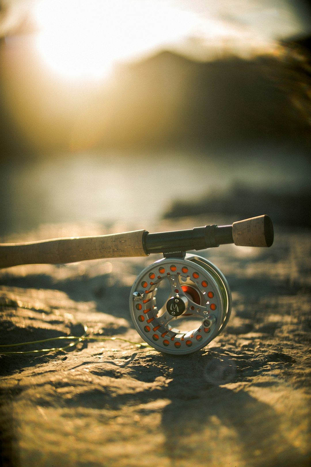 brown and black fishing rod