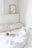 A cozy bedroom featuring a neatly made bed with a plush mattress.