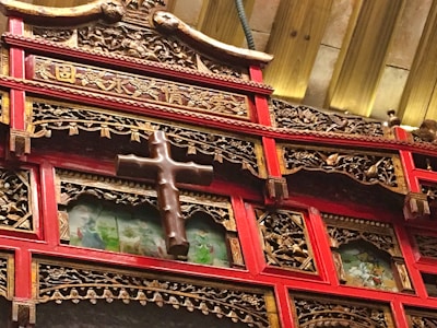 Elegant wooden church panel with intricate CNC-carved patterns highlighted by subtle golden accents