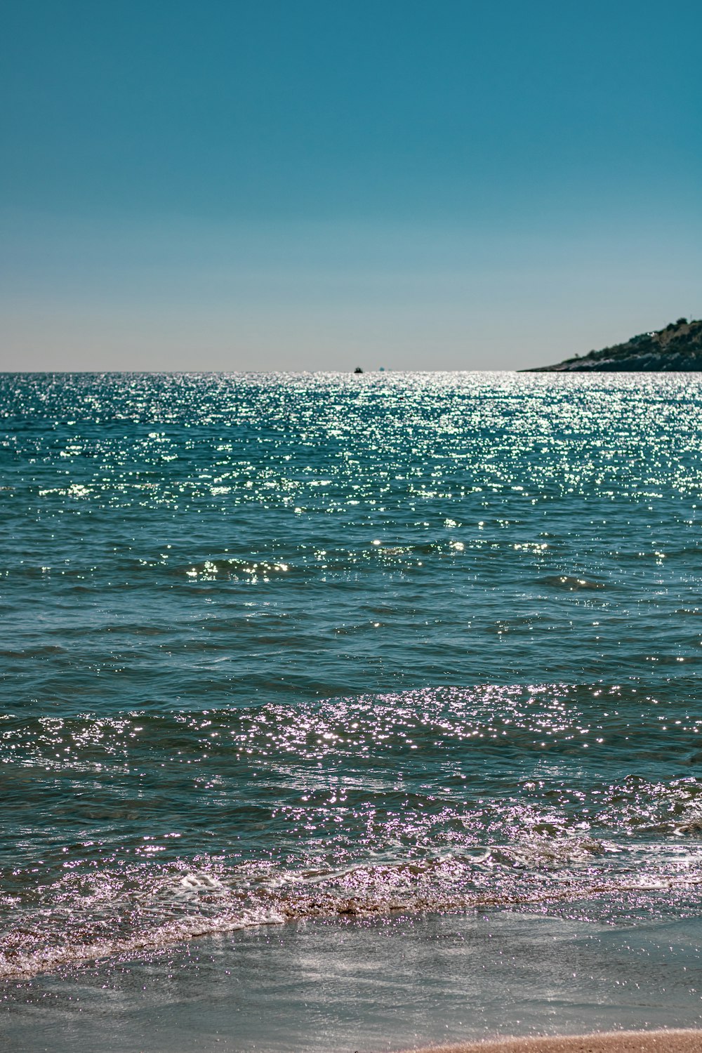 blue sea under blue sky during daytime