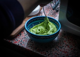 green plastic bowl on table