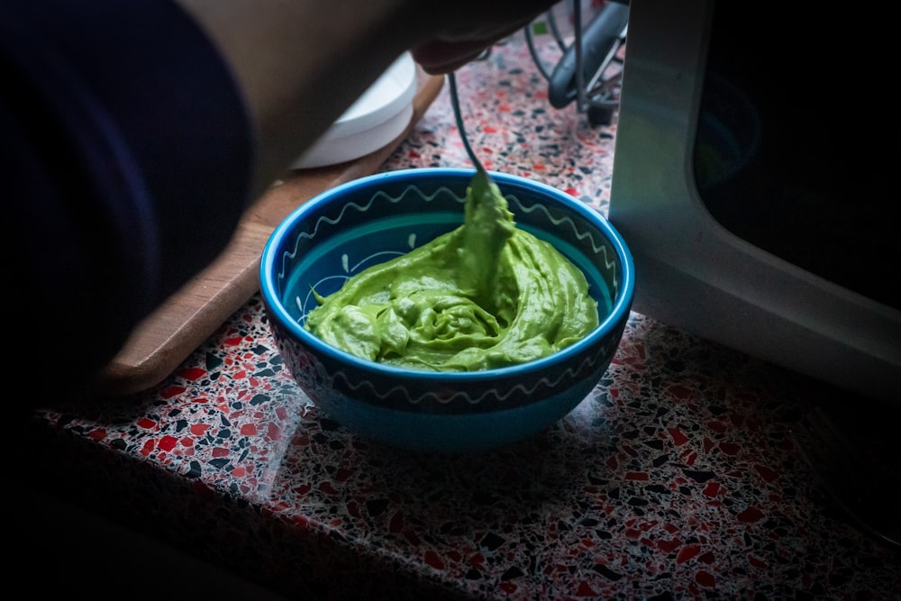 green plastic bowl on table