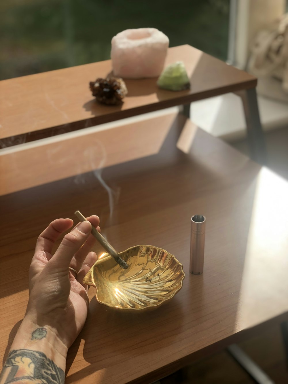 person holding silver fork with yellow and green round fruit